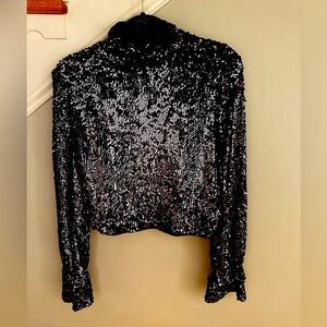 Free People black backless sequin top. So fun. Great with jeans or dress it up